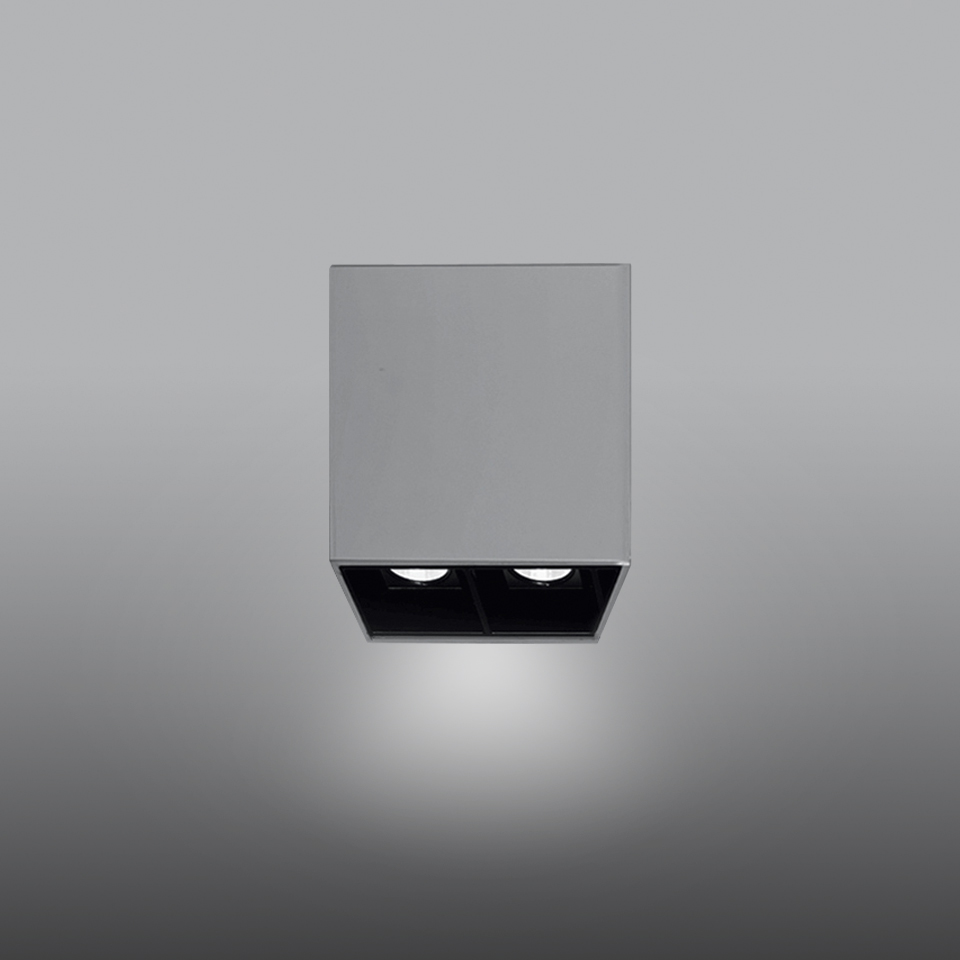 Artemide Sharp SMD surface-mounted ceiling spotlight, grey square housing with dual black recessed LED light sources.