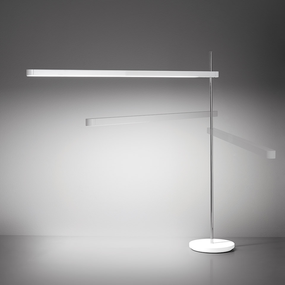 Artemide Talak Professional Table lamp: white elongated LED bar on slim vertical stem with adjustable arm and circular base