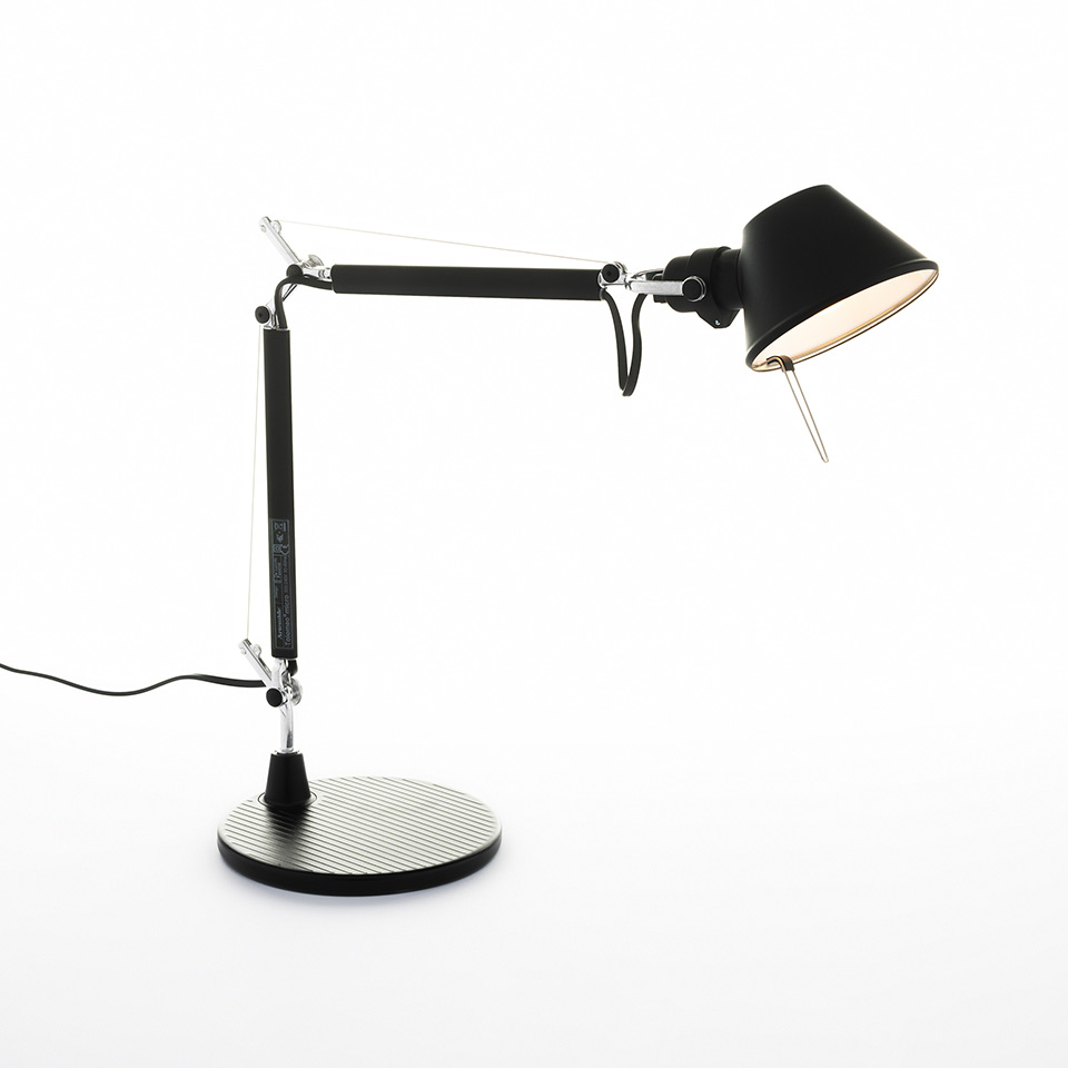 Artemide Tolomeo Micro Tavolo desk lamp in black, featuring articulated arm, conical shade, and circular ribbed base