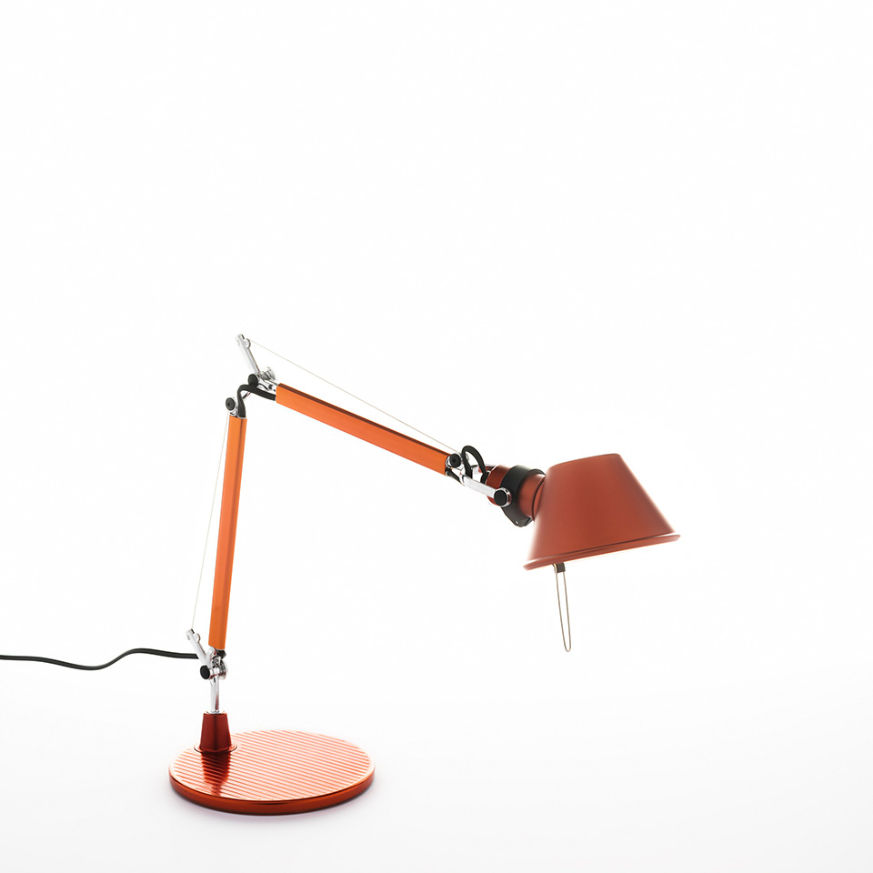 Artemide Tolomeo Micro Tavolo desk lamp in orange, featuring articulated arm, conical shade, and circular base