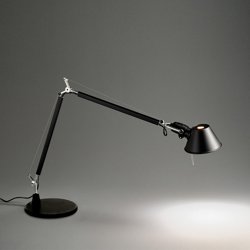 Artemide Tolomeo Tavolo desk lamp in black, featuring adjustable articulated arm, tension cables, and conical shade on round base
