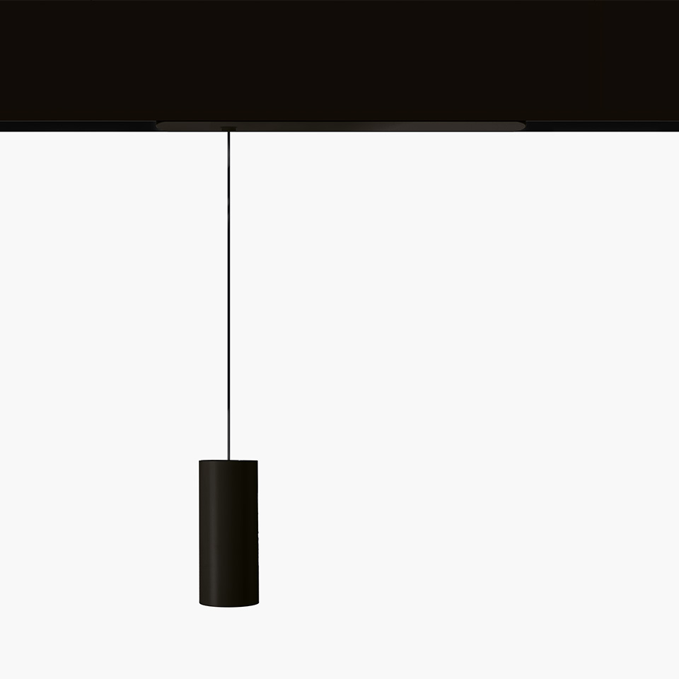 Artemide Vector Pendant Magnetic: black cylindrical pendant lamp suspended by a thin cable from a black magnetic track system