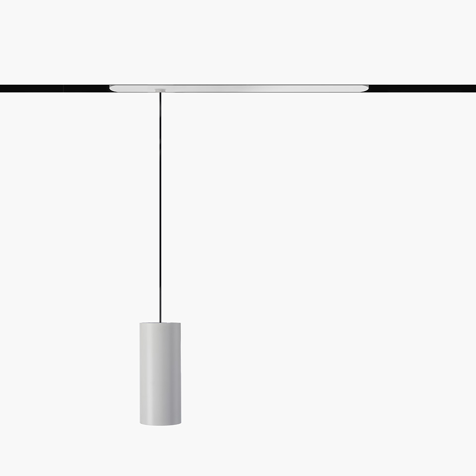 Artemide Vector Pendant Magnetic: white cylindrical pendant lamp hanging from a magnetic track via a thin black cable