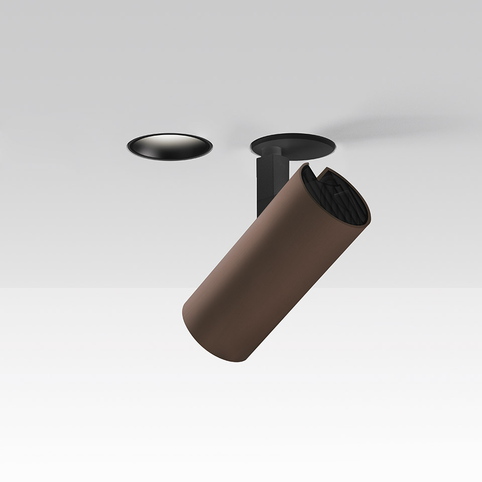 Faretto da incasso a soffitto Artemide Vector Recessed: rosone nero a sinistra, testa cilindrica orientabile color bronzo su supporto nero a destra