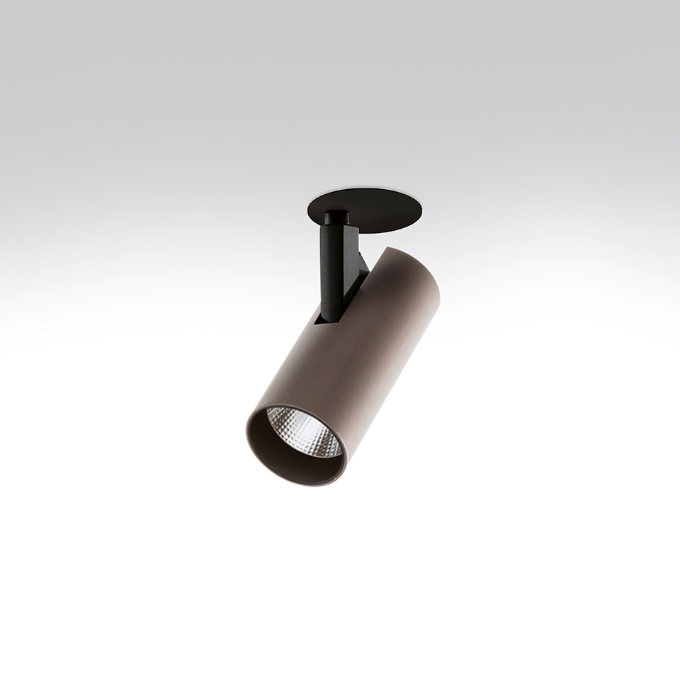 Artemide Vector Semirecessed spotlight: adjustable cylindrical bronze body with LED, black ceiling mount, tilted for directional lighting