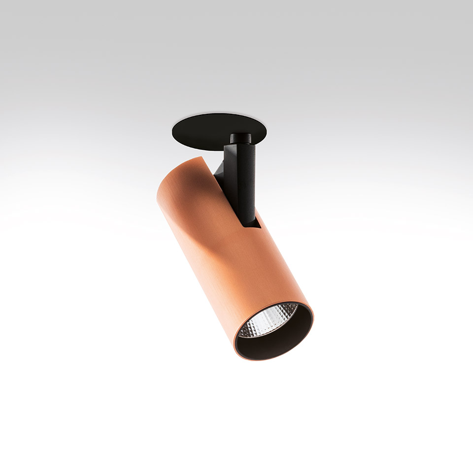 Artemide Vector Semirecessed spotlight: adjustable copper cylindrical head with LED lens on black recessed ceiling mount