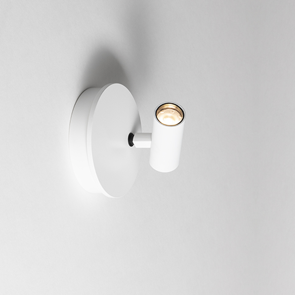 Artemide Vector Wall lamp in white, circular base with adjustable cylindrical spotlight head mounted on wall
