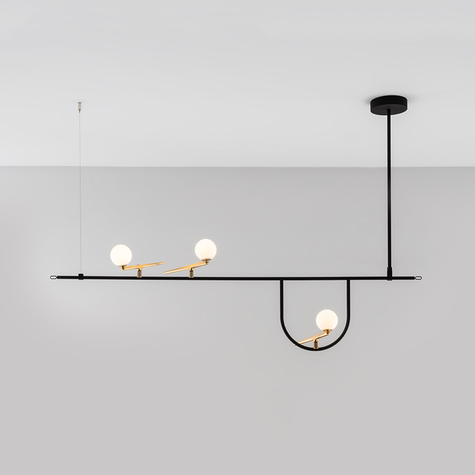 Artemide Yanzi pendant lamp: black linear bar with U-shaped drop, three opal glass spheres on gold brass arms