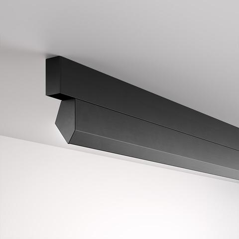 Artemide A.24 Wall Washer: sleek black rectangular ceiling-mounted linear fixture with angled diffuser for wall washing