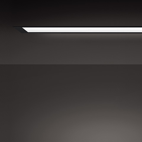 Artemide A.39 Incasso Emissione Diffusa: ultra-slim recessed linear LED ceiling light emitting soft diffused light against dark ceiling