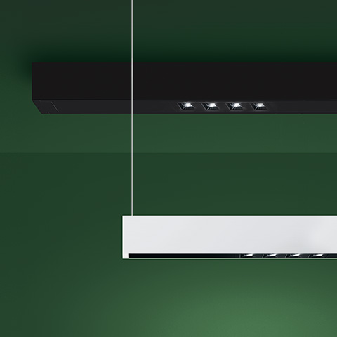 Artemide A.39 pendant and ceiling fixtures: black ceiling version with four directional LED spotlights, white pendant linear version below