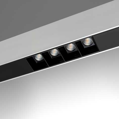 Artemide A. Sharping recessed linear ceiling fixture with four adjustable LED spotlights in black housing and white trim