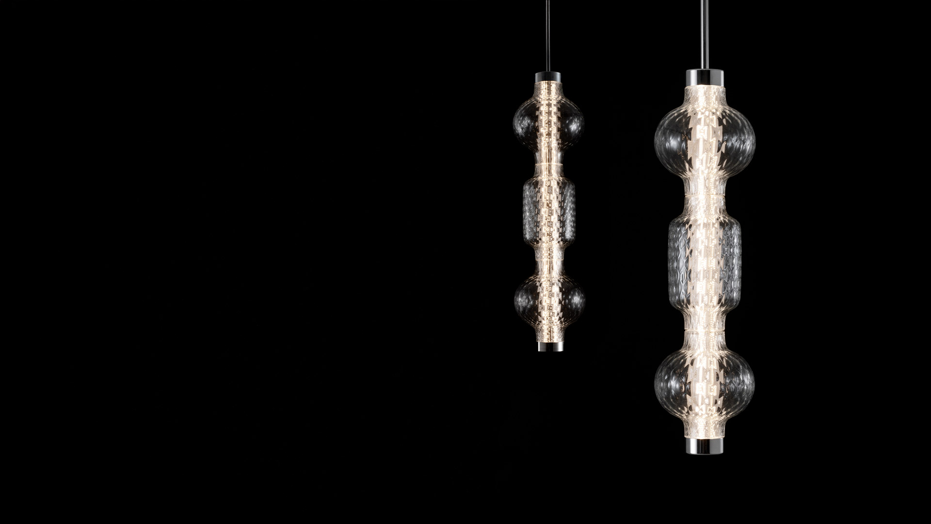 Artemide Alambicco table lamp: tall slender column of stacked glass spheres with central LED strip on chrome circular base