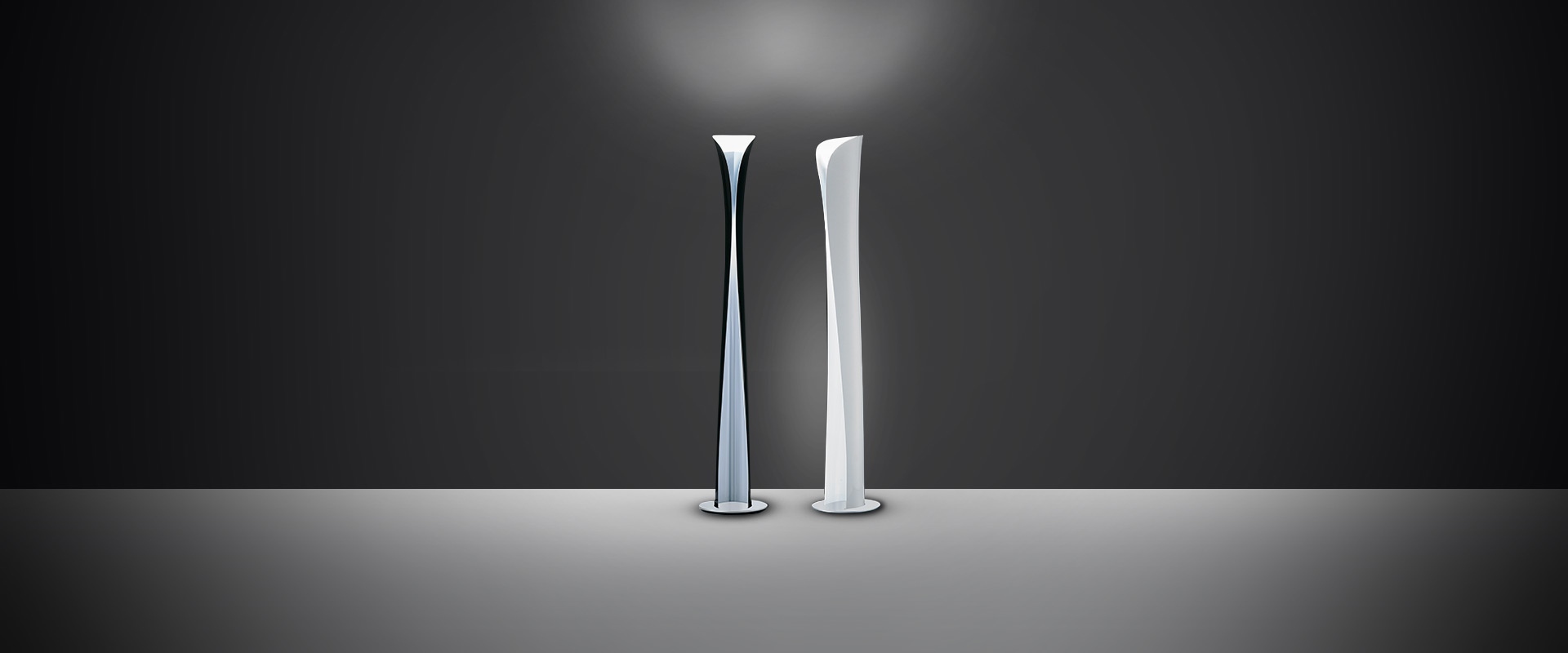 Artemide Cadmo wall lamp in white, hourglass-shaped diffuser emitting upward and downward light beams on a grey wall