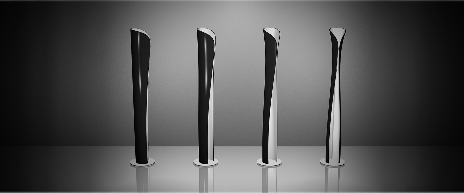 Artemide Cadmo wall lamp with hourglass-shaped dark body, emitting soft white light upward and downward on a grey wall