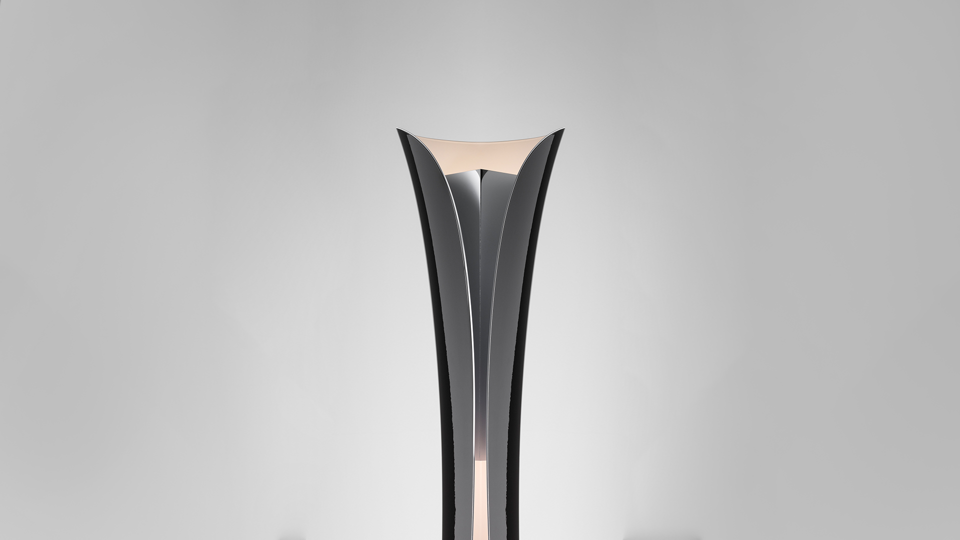 Two Artemide Cadmo floor lamps with slender twisted stems: left in light blue, right in white, emitting upward light