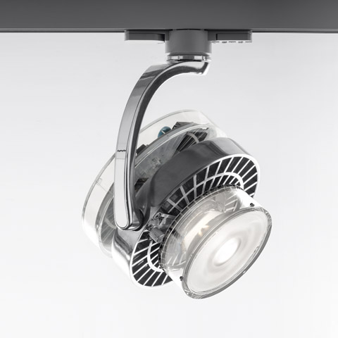 Artemide Cata TIR track spotlight in chrome, with transparent heat-sink fins and LED lens, mounted on black ceiling rail