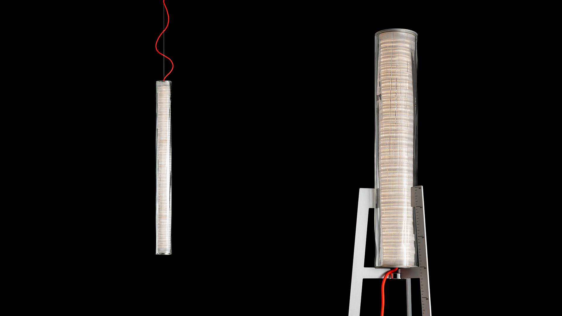 Artemide Pale collection: multiple LED tube lights in pendant, floor, table, and portable configurations against black background with red cord