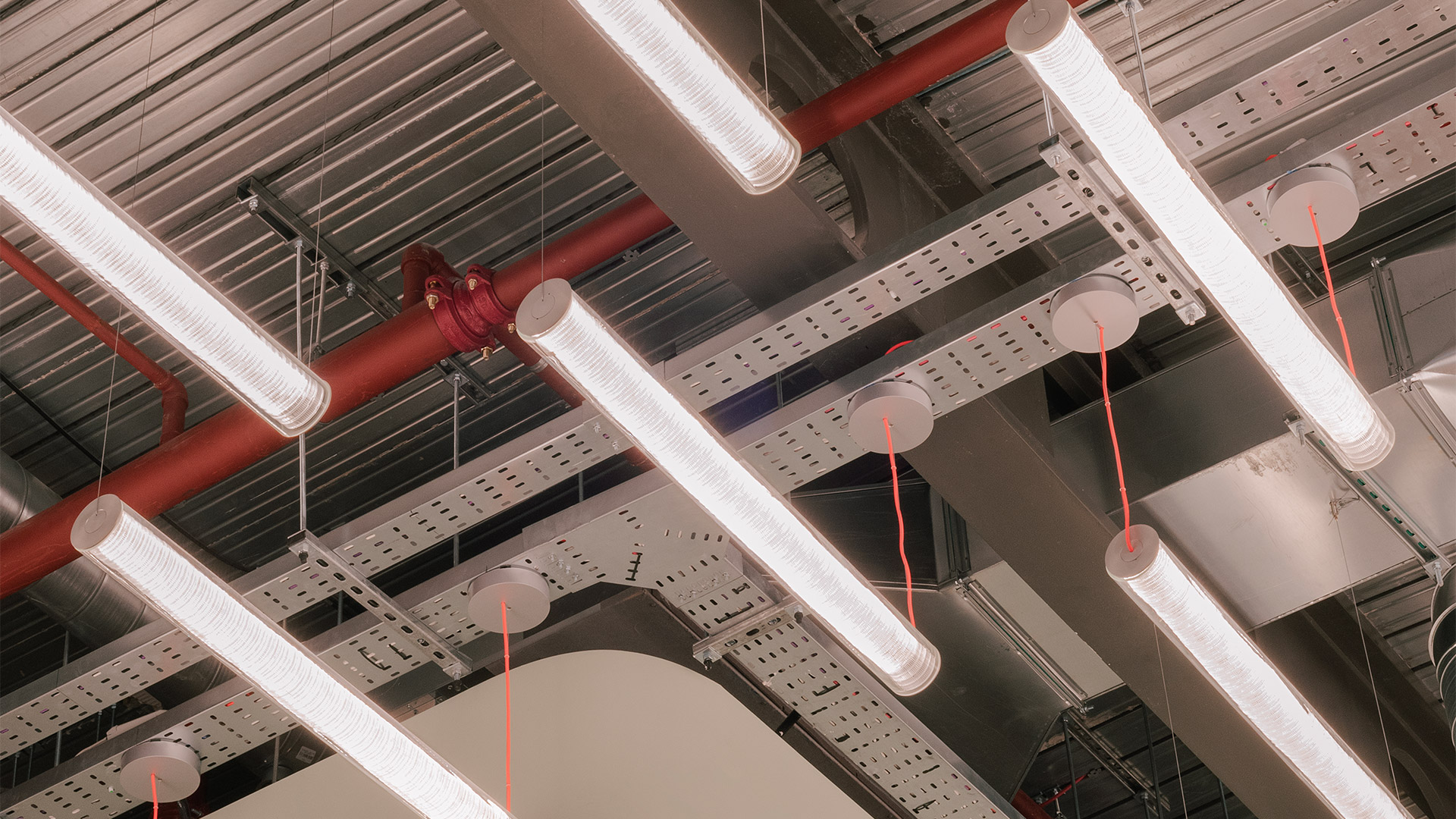 Artemide Criosfera: cylindrical woven lamp in pendant version with red cord and floor version on metal stand