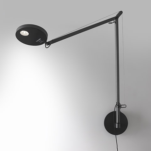 Artemide Demetra Parete wall lamp in black, with adjustable arm, tension cable, and circular LED head mounted on round wall base