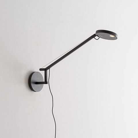 Artemide Demetra Micro Parete wall lamp in anthracite, featuring an adjustable arm and circular LED head mounted on a round wall base