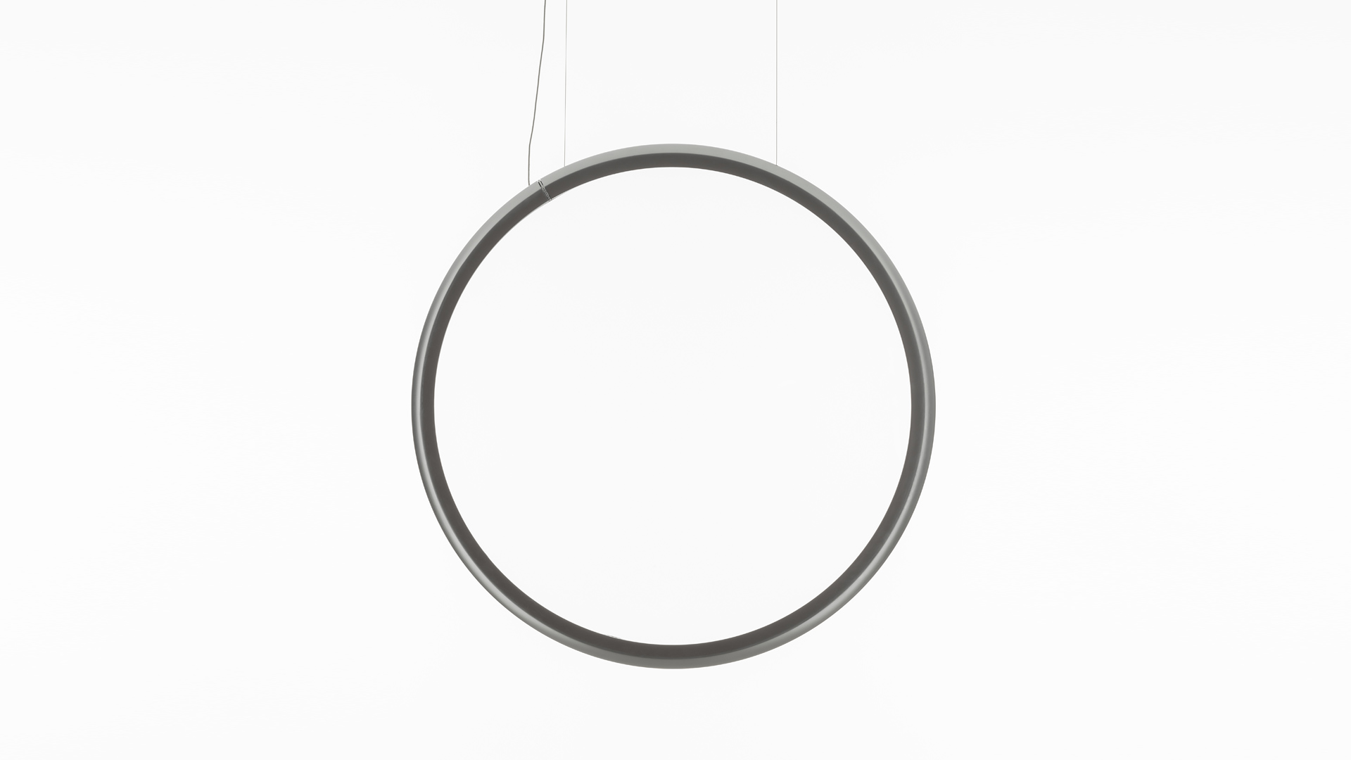 Lampada a sospensione Artemide Discovery Vertical: diffusore bianco circolare a disco con sottile cornice nera, sospesa da un cavo sottile