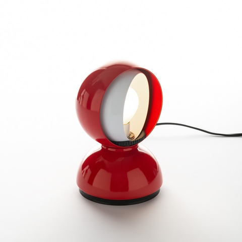 Artemide Eclisse table lamp in red, featuring a spherical rotating shade on a round base, with inner white diffuser visible