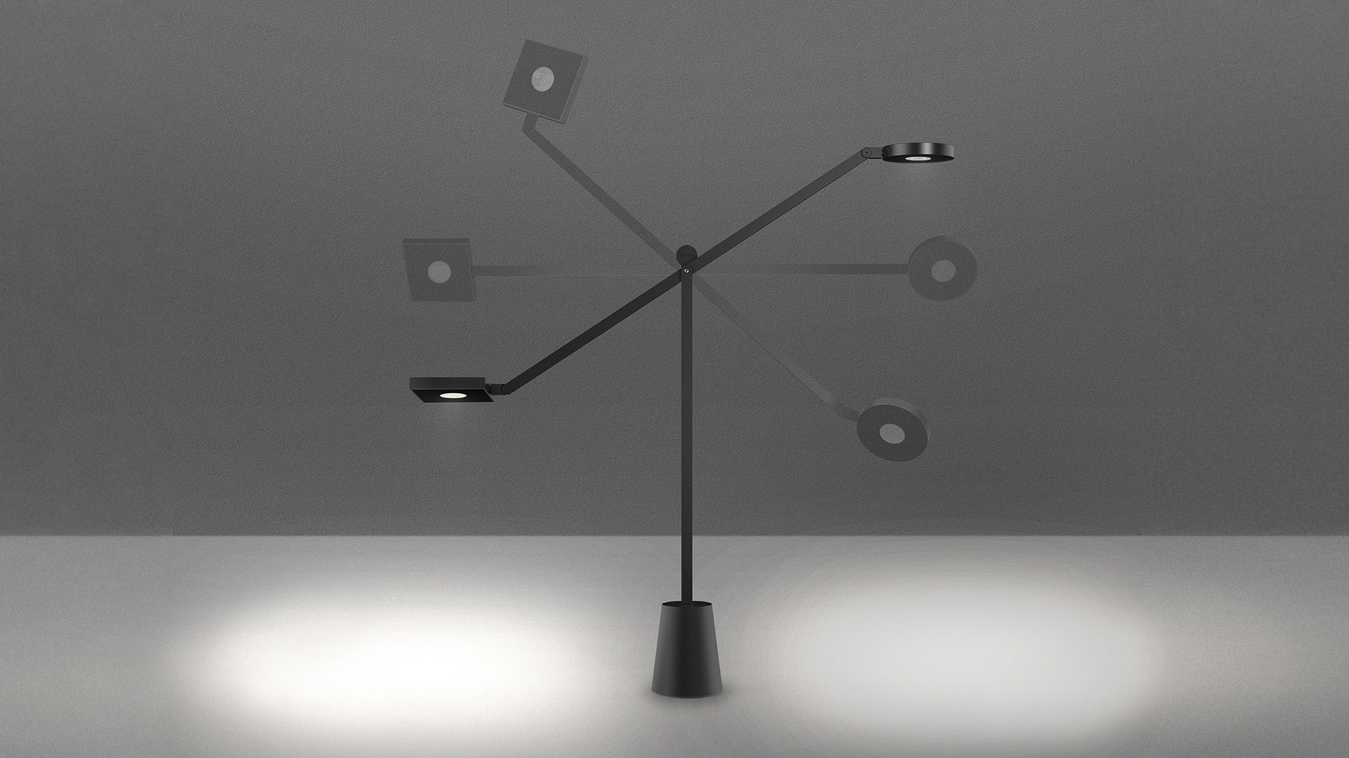 Artemide Equilibrist table lamp in black, featuring two adjustable arms with LED heads on a conical base, casting focused light pools.