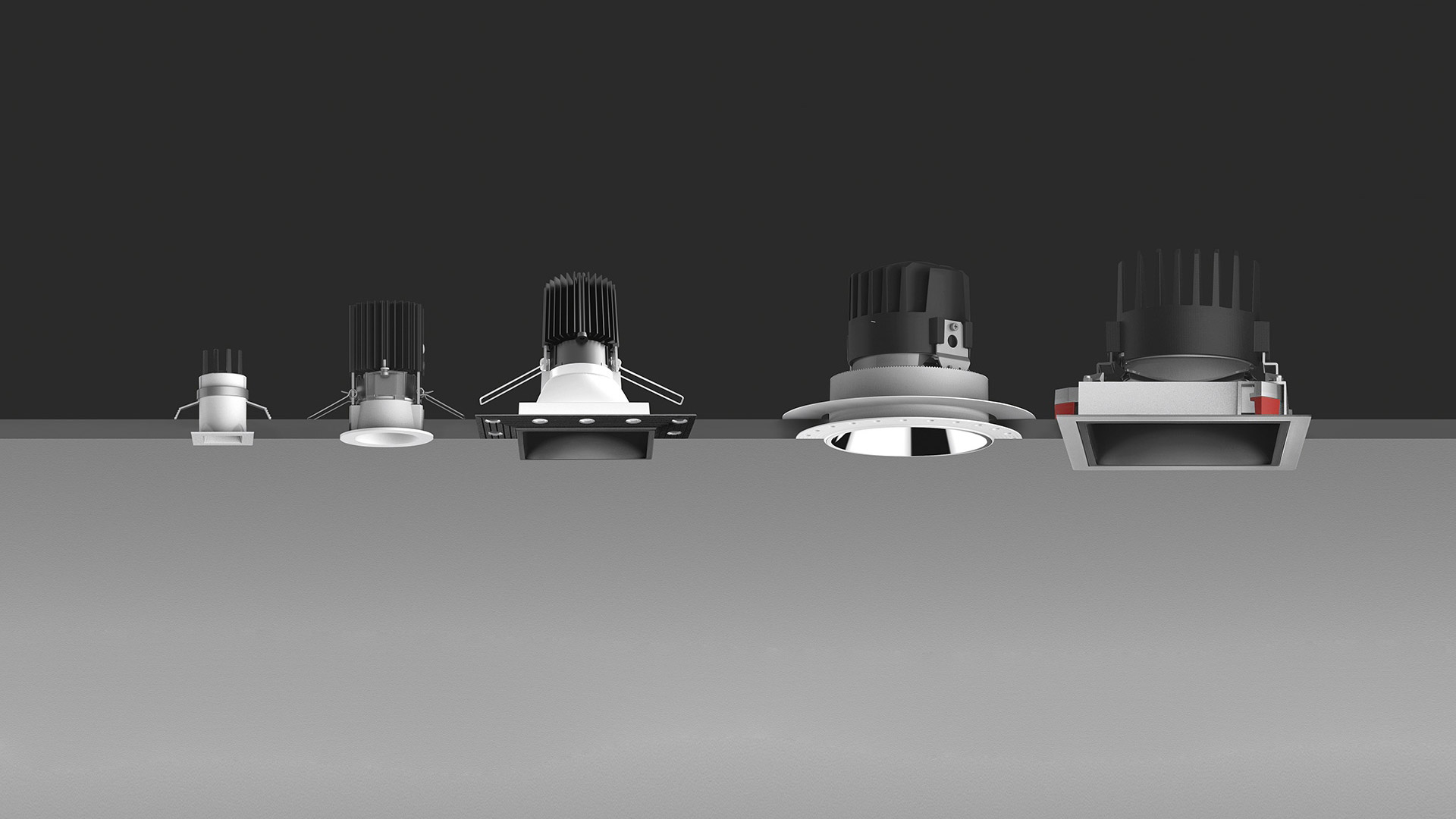 Five Artemide Everything 80 Trim recessed downlights in a row, varying in round and square trims, shown against a dark background