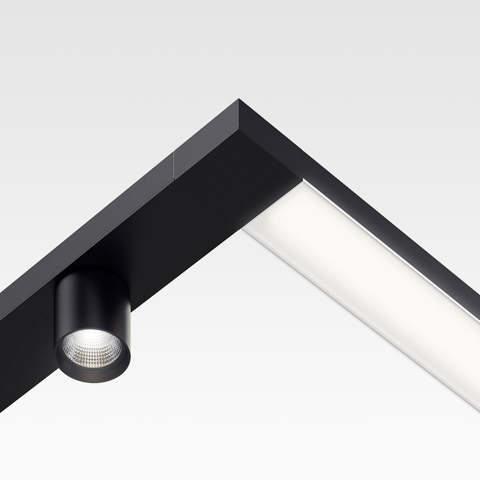 Artemide Hoy System: binario angolare nero con diffusore lineare integrato e faretto LED cilindrico orientabile all'angolo