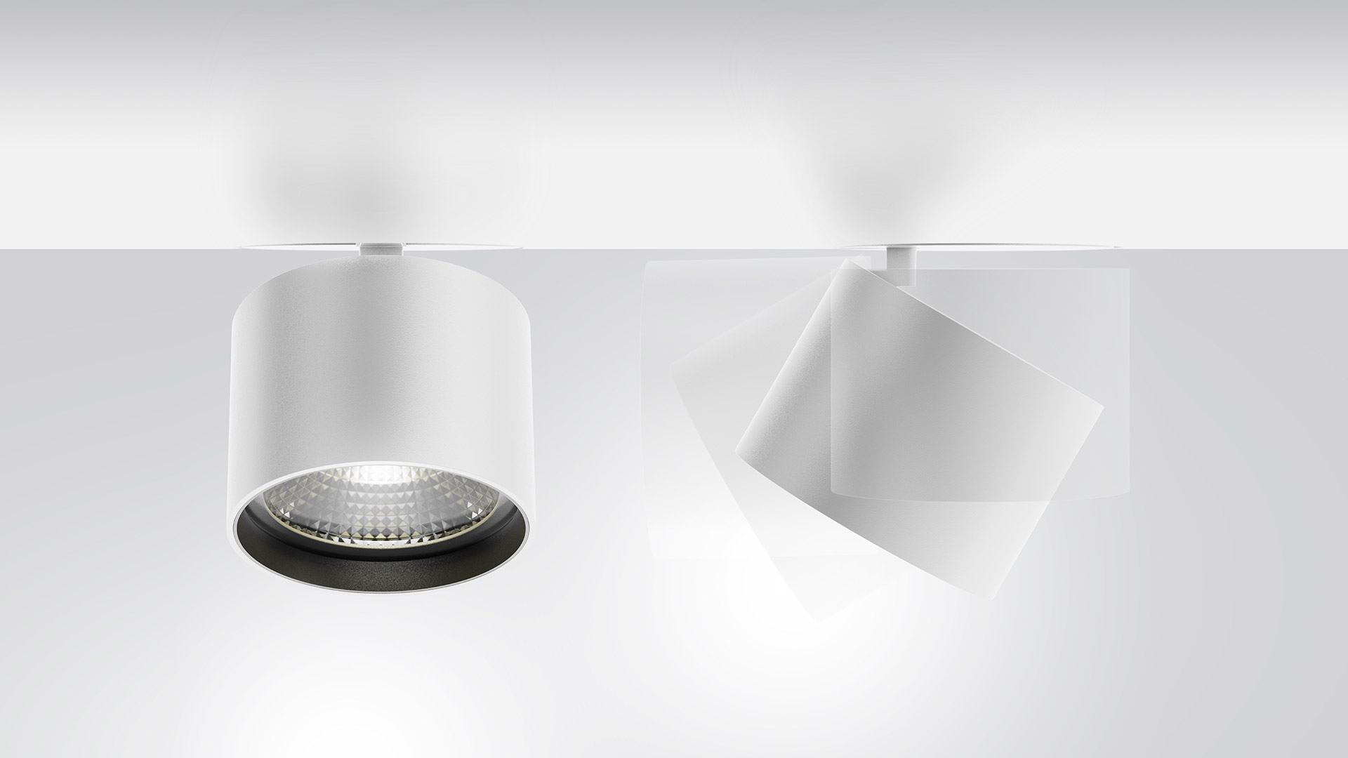 Due faretti Artemide Hoy su binario in bianco: sinistra downlight cilindrico con bordo nero, destra spot cubico orientabile su binario