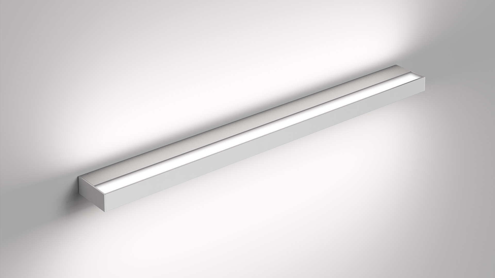 Artemide Hoy Parete wall lamp: slim rectangular white fixture emitting soft upward and downward light against a white wall