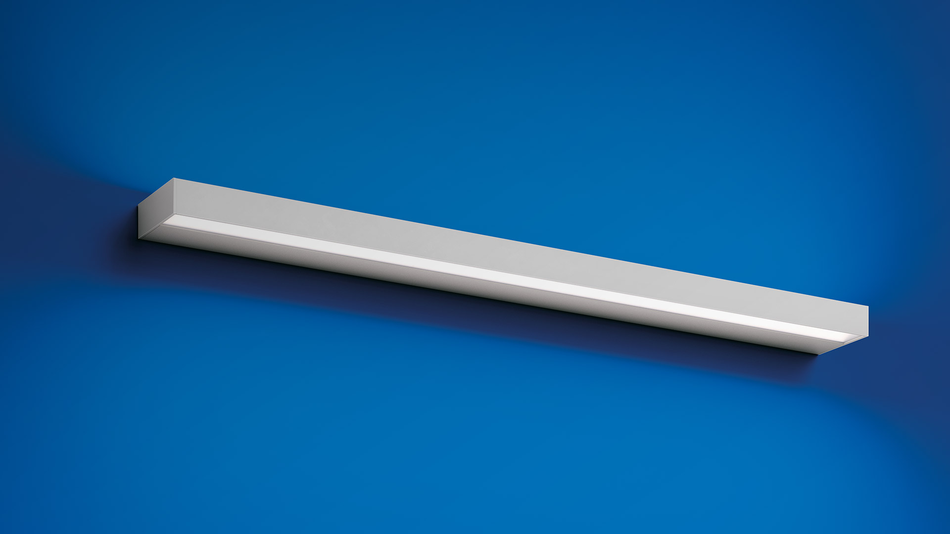 Artemide Hoy Parete wall lights: large white version on dark wall, two smaller black versions on white wall, emitting warm linear light