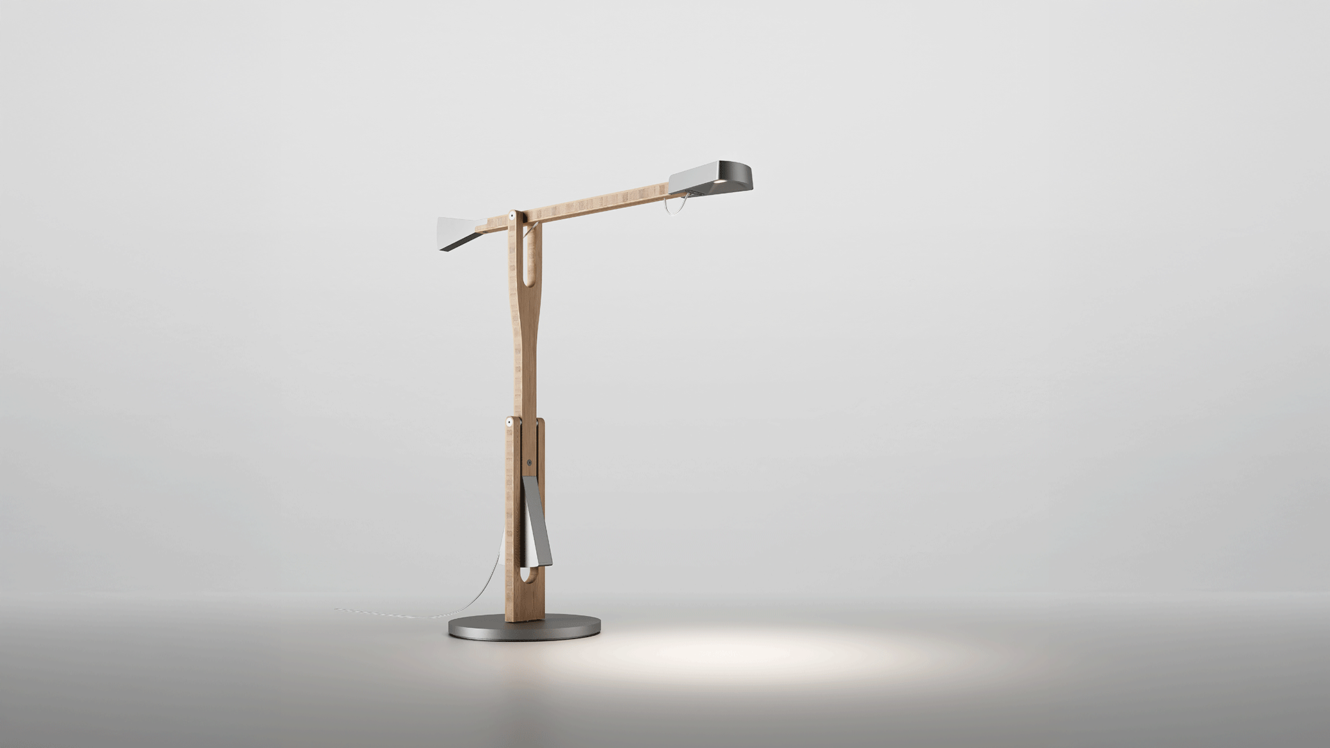 Artemide Internode floor lamp with natural wood arm, grey conical shades at each end, and a round metal base casting focused light