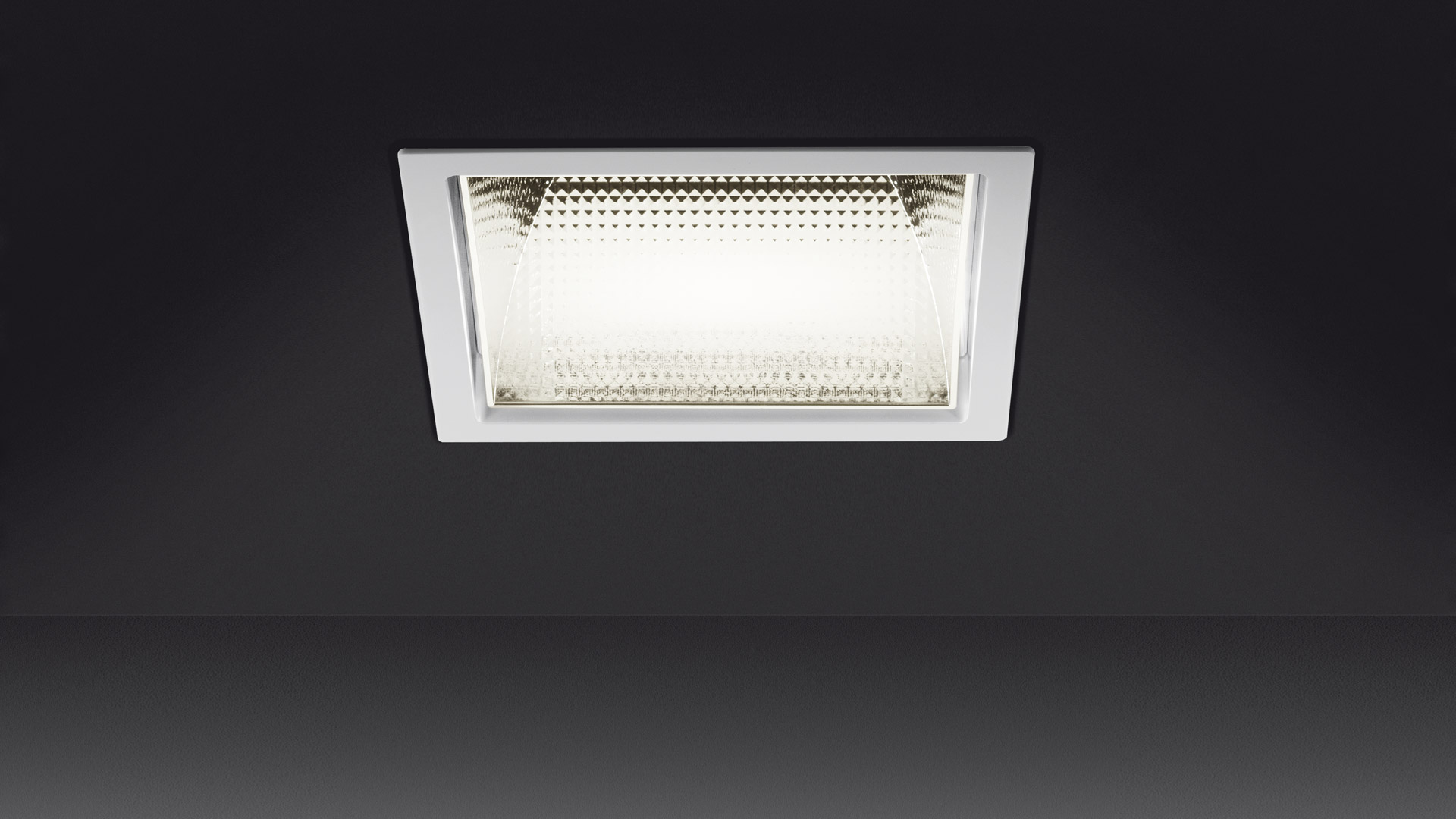 Artemide Luceri Kadro Trim recessed LED ceiling light with square white frame and prismatic diffuser, flush-mounted.