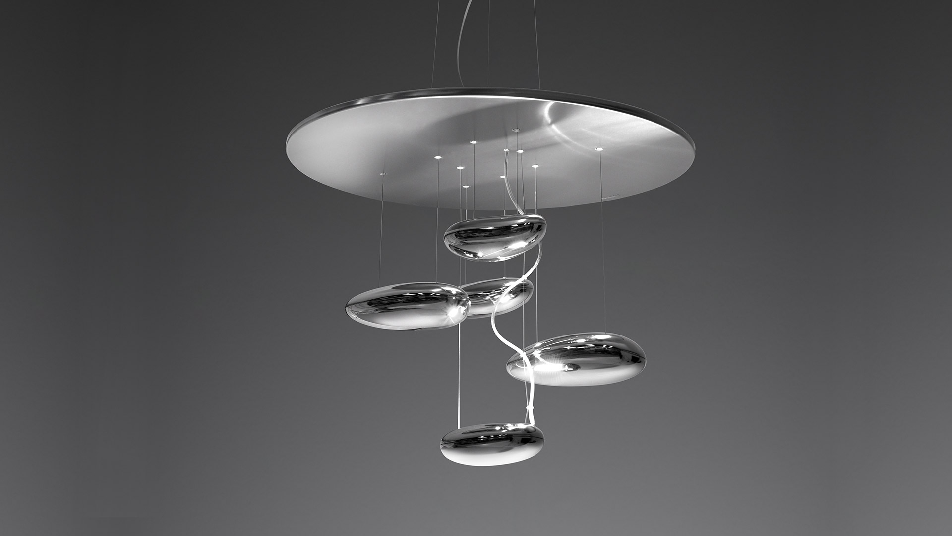 Artemide Mercury pendant lamp: large disc canopy suspending five chrome liquid-drop shaped diffusers arranged in a spiral cascade