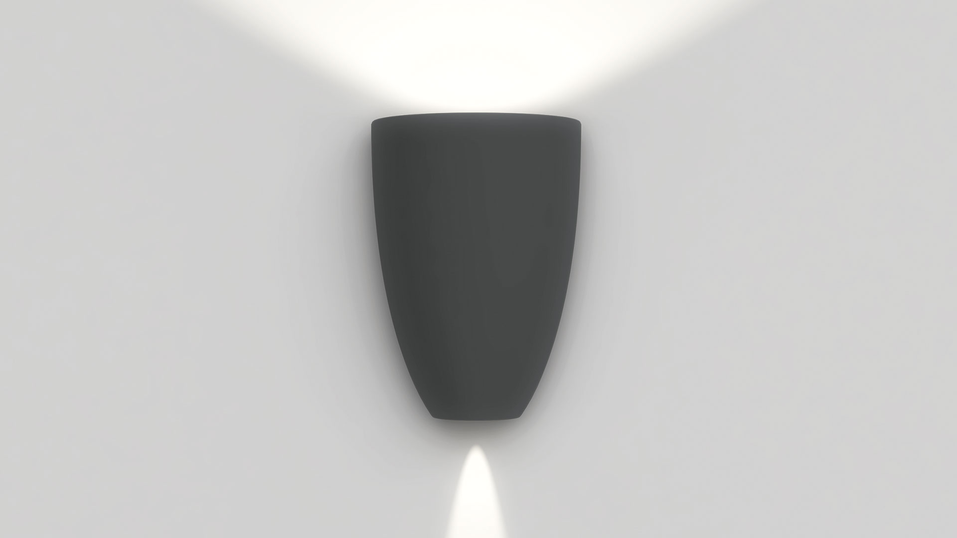 Applique da parete Artemide Molla in grigio scuro, con emissione di luce verso l'alto e il basso su parete bianca