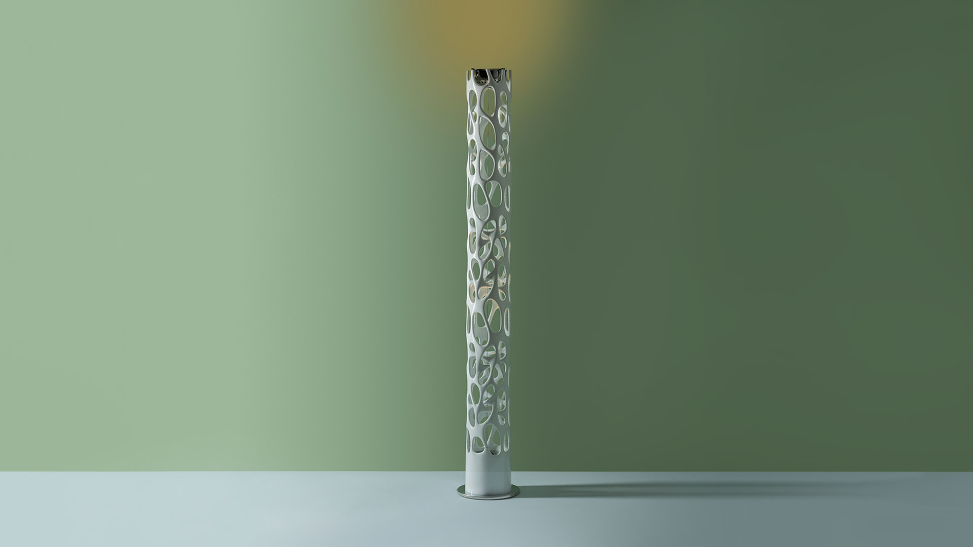 Three Artemide New Nature floor lamps with white organic biomorphic structures featuring irregular openings, against dark background