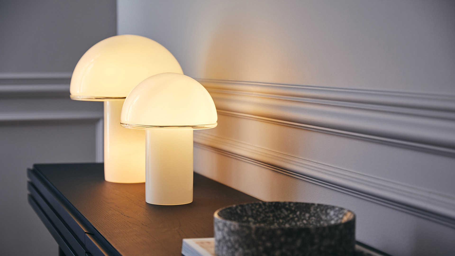 Three Artemide Onfale table lamps in white opal glass, mushroom-shaped, displayed in small, medium, and large sizes