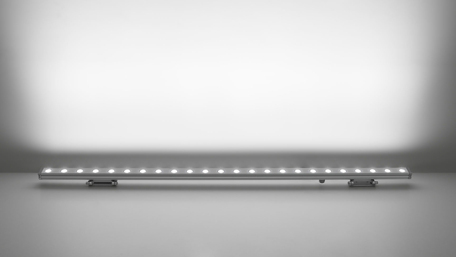 Artemide Spike linear LED bar fixture in silver aluminum profile with multiple LED sources, designed for architectural lighting