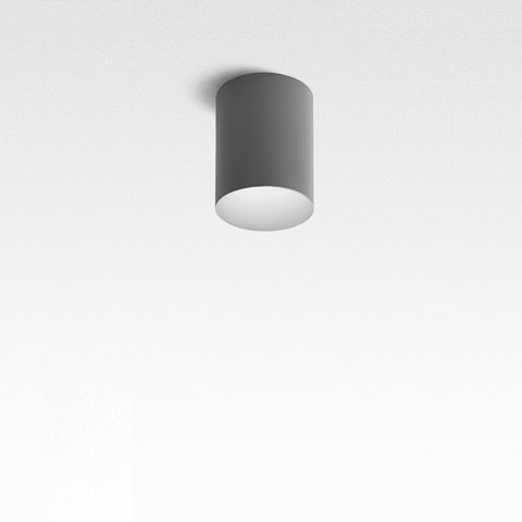 Tagora Soffitto 270 di Artemide: plafoniera cilindrica compatta grigia con diffusore bianco, faretto a soffitto da superficie