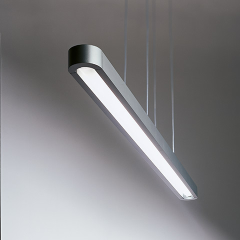 Artemide Talo suspension lamp: elongated diagonal fluorescent tube in aluminum, white diffuser, suspended by thin cables