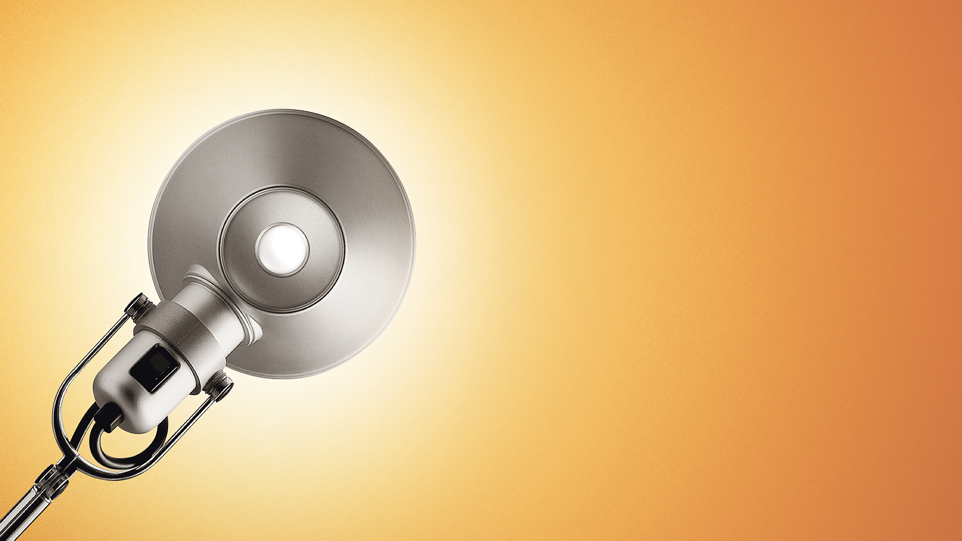 Artemide Tolomeo Tavolo and Tolomeo Mini Tavolo desk lamps in chrome and matte finish, with adjustable arms on round bases, against yellow background