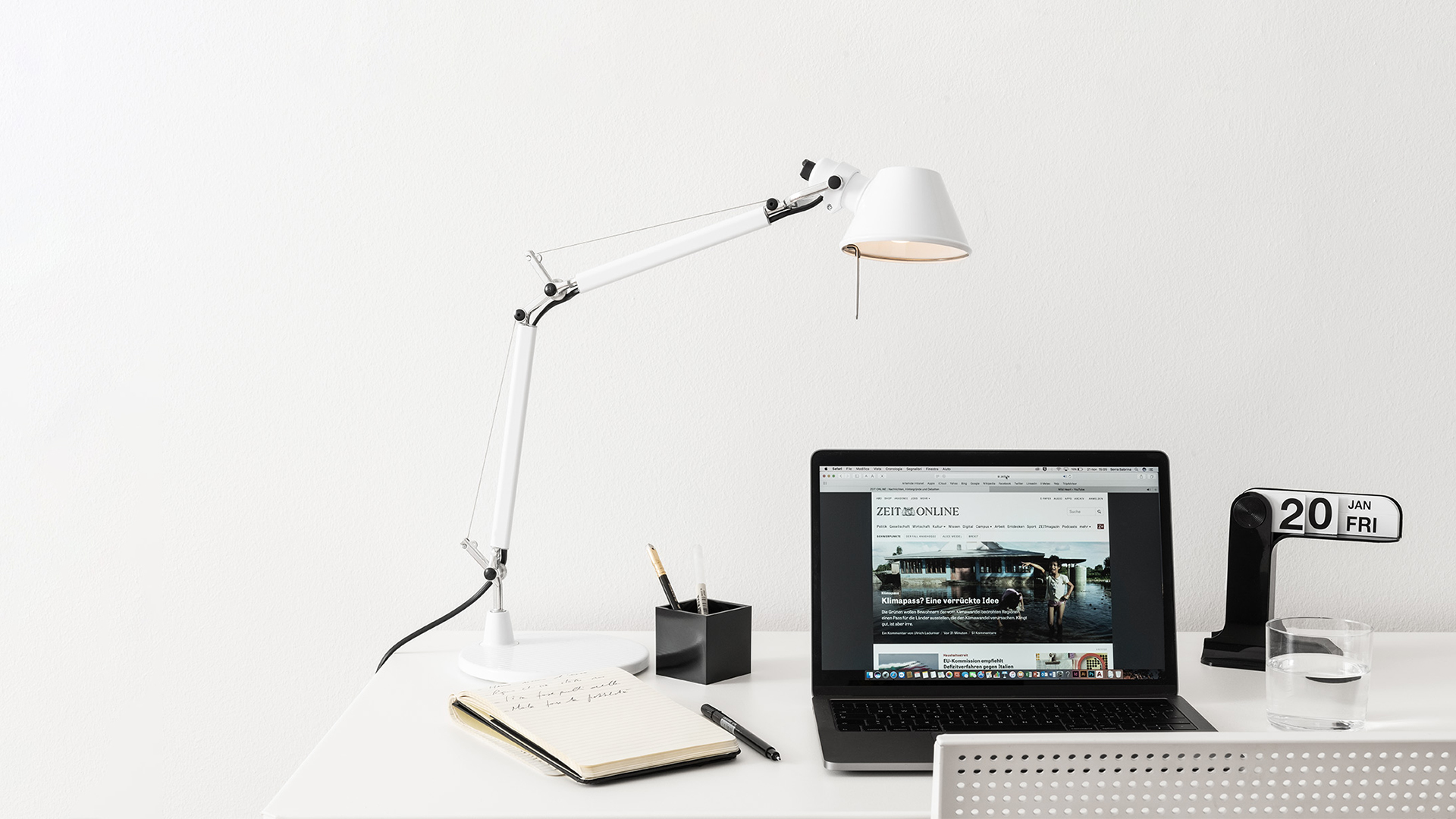 Artemide collection in burgundy: Tolomeo floor and micro table lamps, Nessino and other iconic designs; detail of Tolomeo adjustable arm