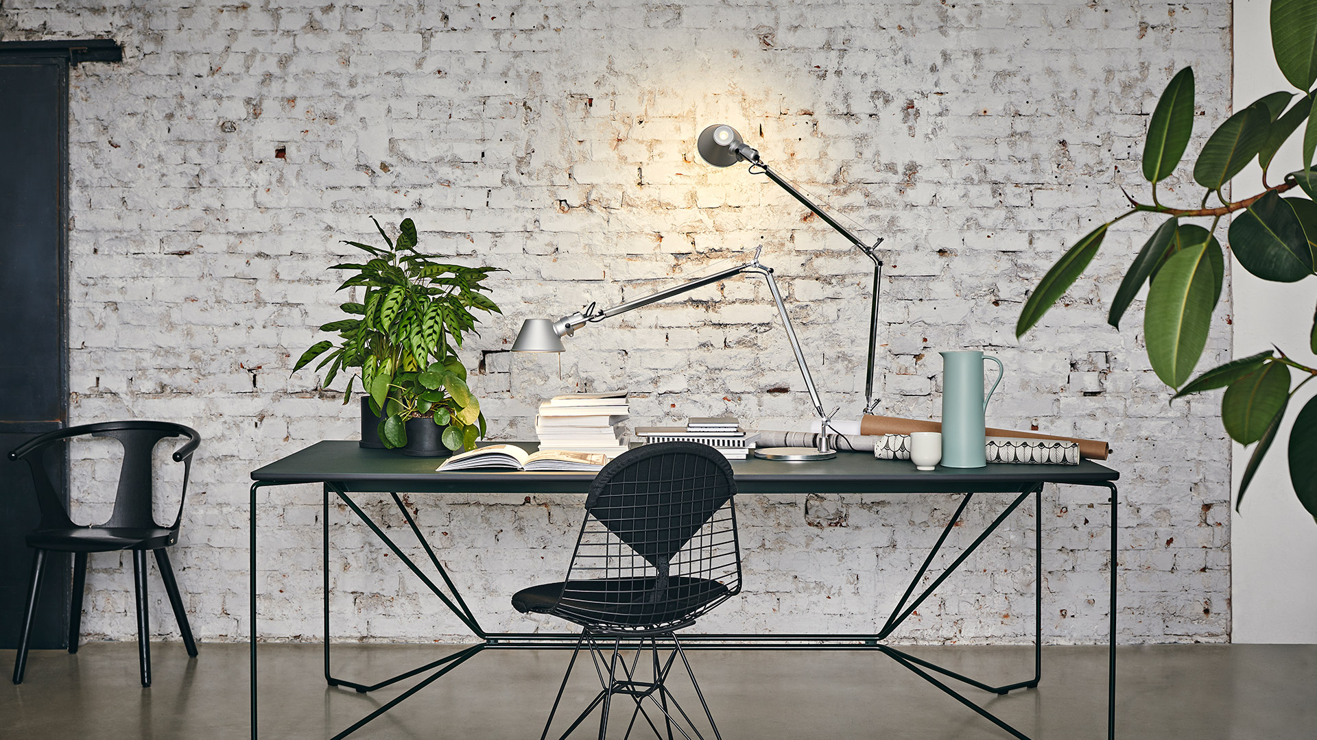 Artemide Tolomeo Tavolo desk lamp: adjustable aluminum arm with jointed mechanism and conical shade emitting warm white light