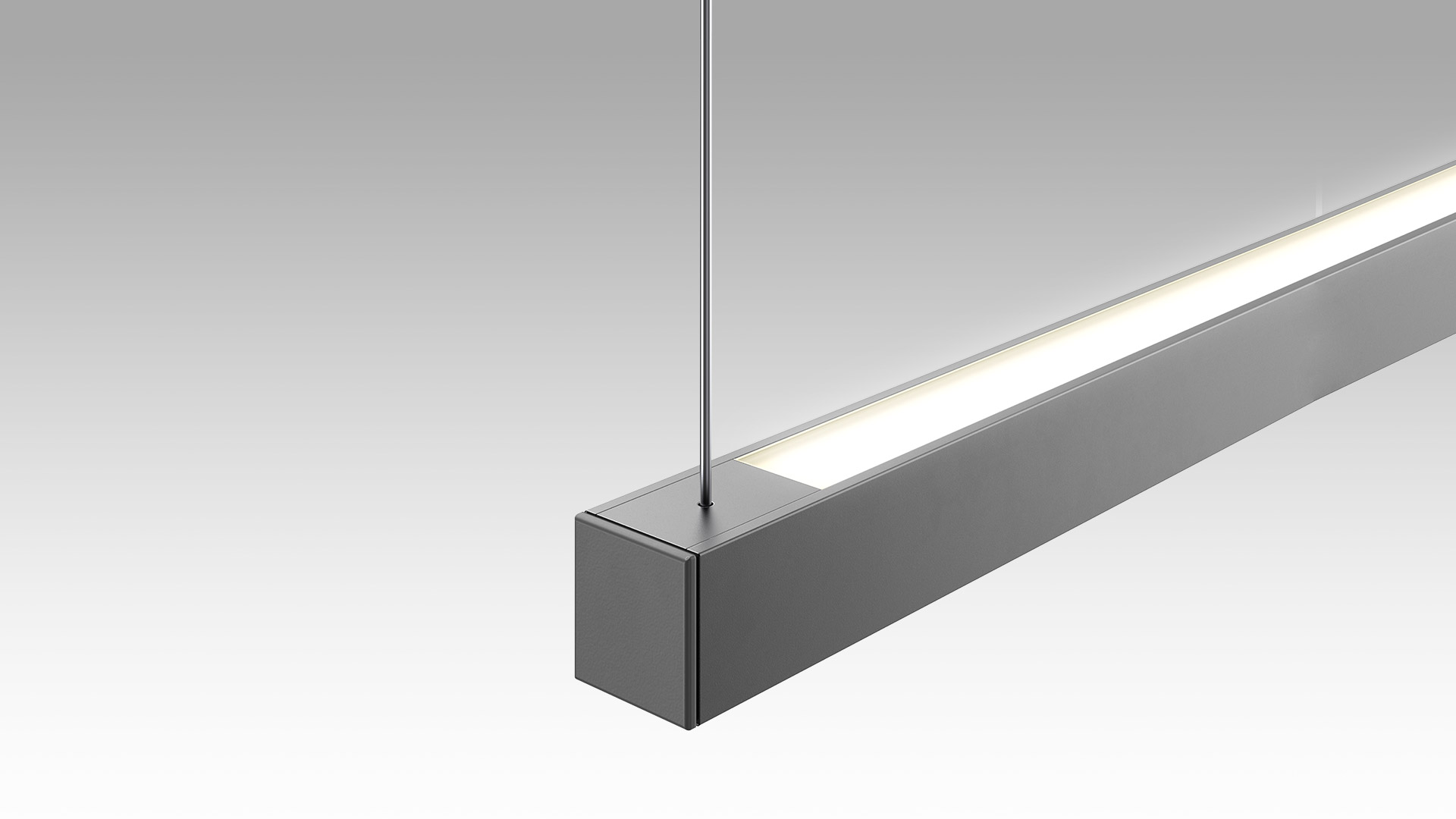 Turn Around Sospensione di Artemide: elegante lampada a sospensione lineare LED rettangolare grigio scuro con diffusore opaco, sospesa da cavo in acciaio