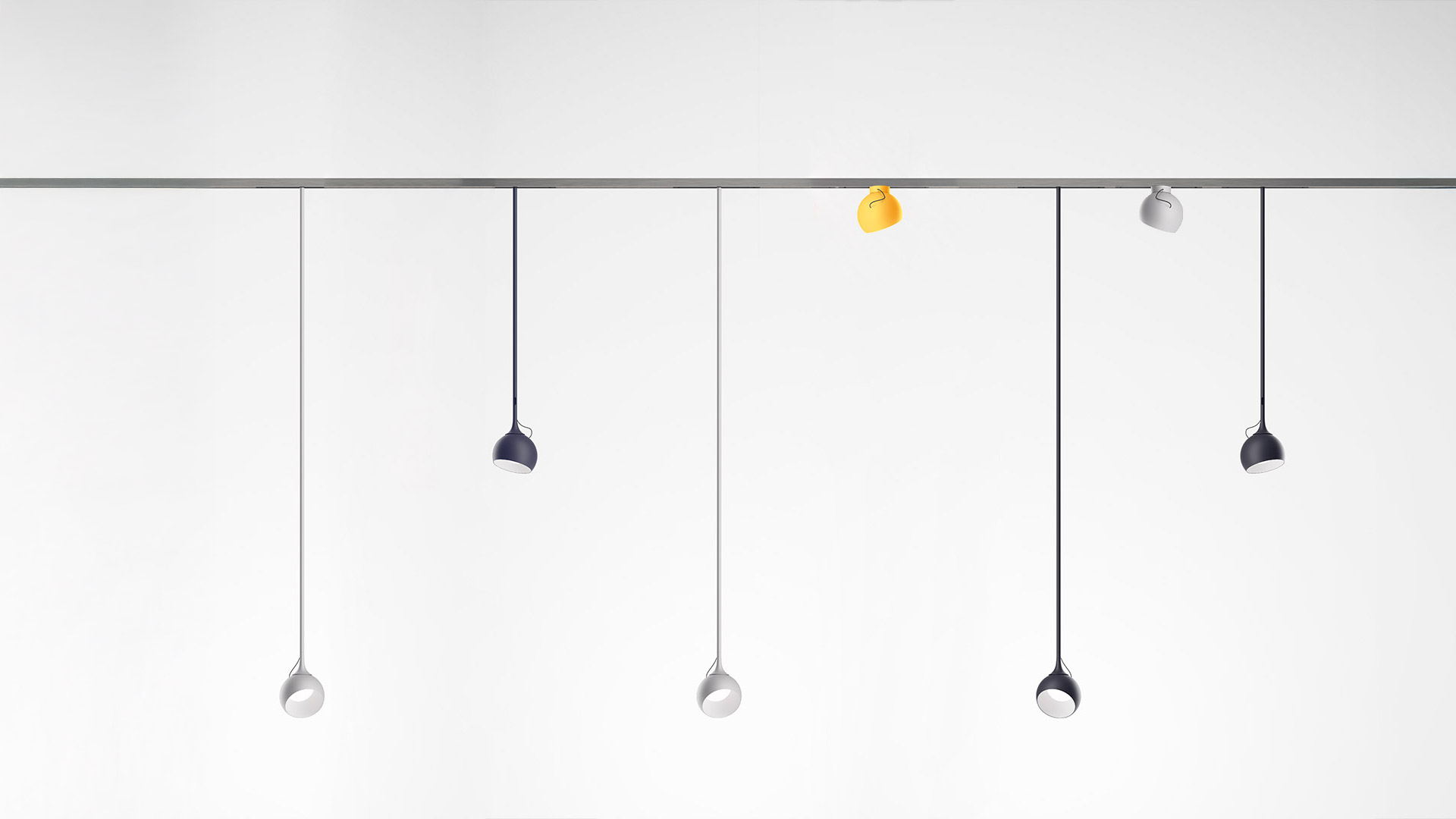 Artemide Turn Around System: binario luminoso sospeso curvo in metallo scuro con faretti LED integrati e pendenti regolabili