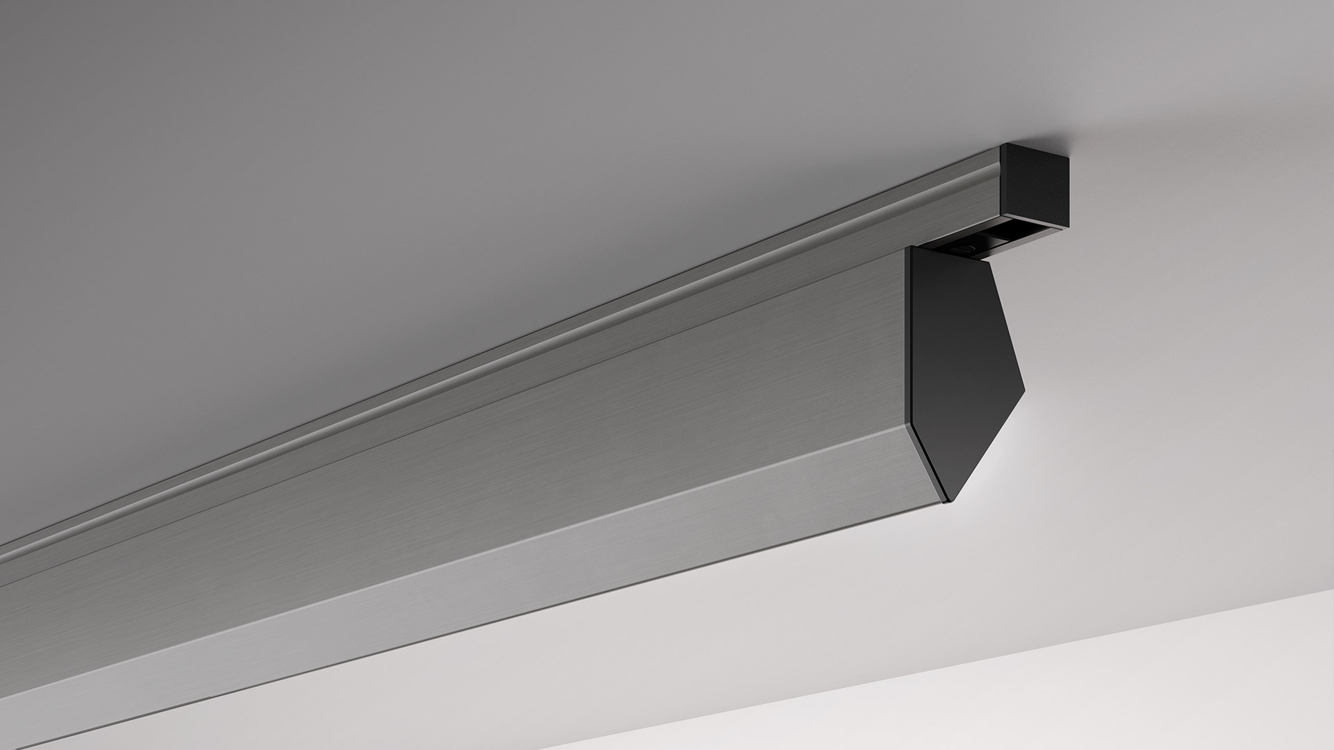 Lampada lineare da soffitto Artemide in alluminio spazzolato con terminale angolare nero, installata lungo il raccordo parete-soffitto.