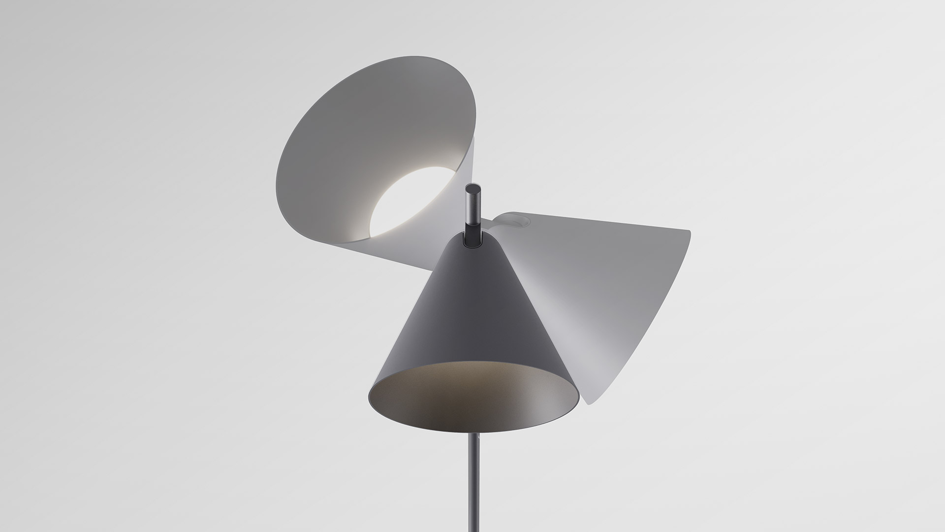 Due lampade da terra Artemide Vea: versione nera alta a sinistra, versione bianca più bassa a destra, entrambe con stelo sottile e base a treppiede
