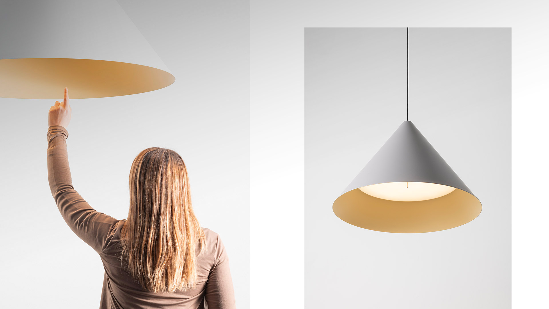 Primo piano della lampada a sospensione Vea di Artemide: paralume conico con esterno bianco e interno color giallo dorato caldo